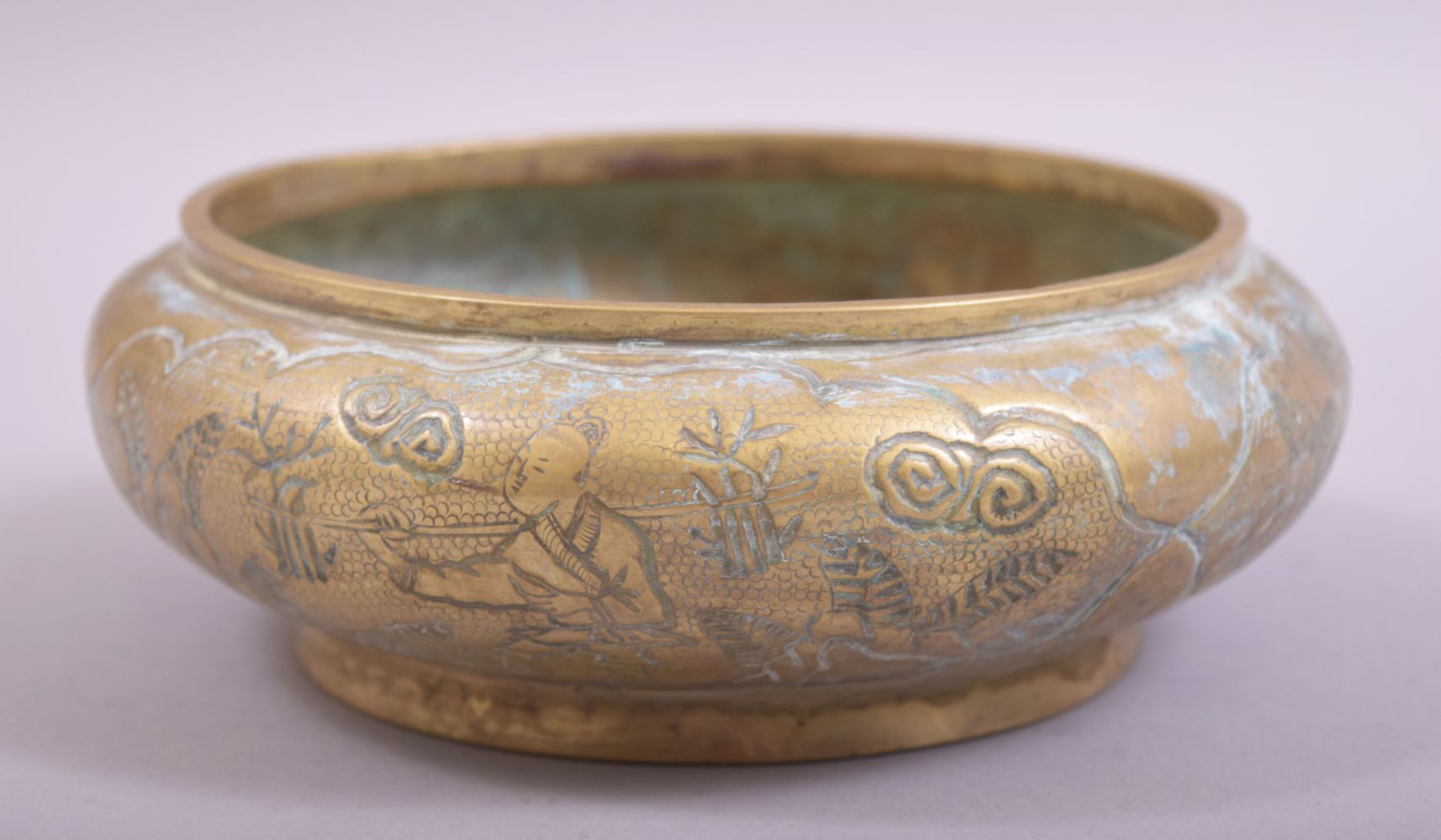A CHINESE EMBOSSED AND CHASED BRONZE BOWL, with scenes of men on horseback in outdoor settings,