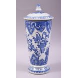 A CHINESE BLUE AND WHITE TALL TAPERING JAR AND COVER, decorated with sprays of native flora, overall