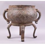 A LARGE ARCHAIC BRONZE TWIN HANDLE CENSER, with zoomorphic handles and supported on four curving