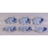 SIX CHINESE BLUE AND WHITE PORCELAIN FISH FORM DISHES, the dishes painted as fish, each dish with