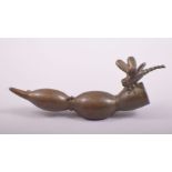A JAPANESE BRONZE MODEL OF A DRAGONFLY ON A LOTUS ROOT, stamped underside, 9cm long.