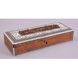 AN INDIAN SANDALWOOD RECTANGULAR GLOVE BOX WITH BONE AND EBONY DOMINO PIECES, box measuring 28.5cm