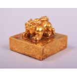 A CHINESE GILT BRONZE LION DOG FORMED SEAL.