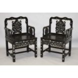 A GOOD PAIR OF CHINESE CARVED HARDWOOD CHAIRS, inlaid with mother of pearl, with well carved bat