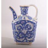 A SMALL TURKISK BLUE AND WHITE KUTAHYA WATER JUG, with sprays of decorative floral motifs, 20.5cm