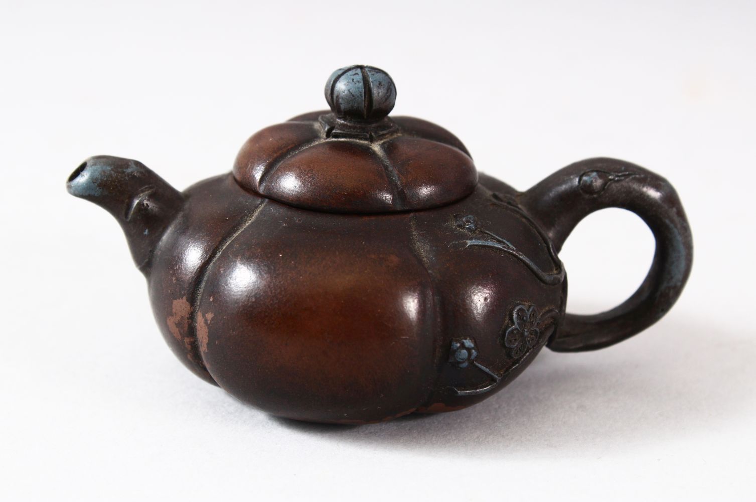 A CHINESE YIXING FLUTED TEAPOT AND COVER, the inner cover with marks, 10.5cm (spout to handle).