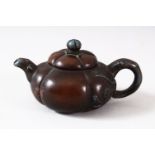 A CHINESE YIXING FLUTED TEAPOT AND COVER, the inner cover with marks, 10.5cm (spout to handle).