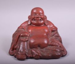 A CHINESE RED LACQUERED FIGURE OF BUDDHA, base 14.5cm wide.