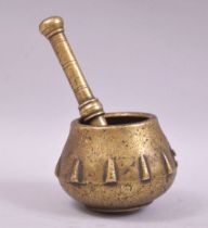 A SMALL 17TH CENTURY BRASS PESTLE AND MORTAR.