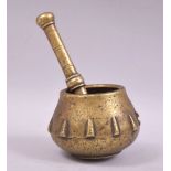 A SMALL 17TH CENTURY BRASS PESTLE AND MORTAR.
