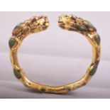 A CHINESE GILDED BRONZE BRACELET, 8cm wide.