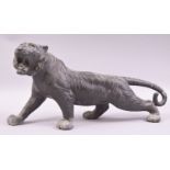 A JAPANESE BRONZE MODEL OF A TIGER, in a predatory stance, 43cm long.