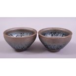 A PAIR OF SMALL CHINESE OIL SPOT GLAZE POTTERY BOWLS, 9cm diameter.