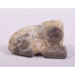 A CHINESE CARVED HARDSTONE FIGURE OF A LION DOG, 6cm long.