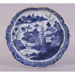 A CHINESE BLUE AND WHITE PORCELAIN TRAY, painted with a river landscape including buildings, figures