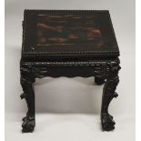 A SMALL CHINESE SQUARE FORM HARDWOOD TABLE, with carved floral frieze, supported on four curving