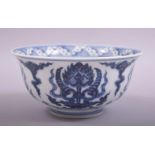 A CHINESE BLUE AND WHITE PORCELAIN BOWL, the interior of the bowl painted with tibetan script, the