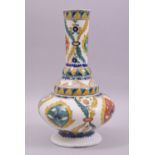 A TURKISH KUTAHYA GLAZED POTTERY VASE, the vase painted with various stylised floral motifs, 26.