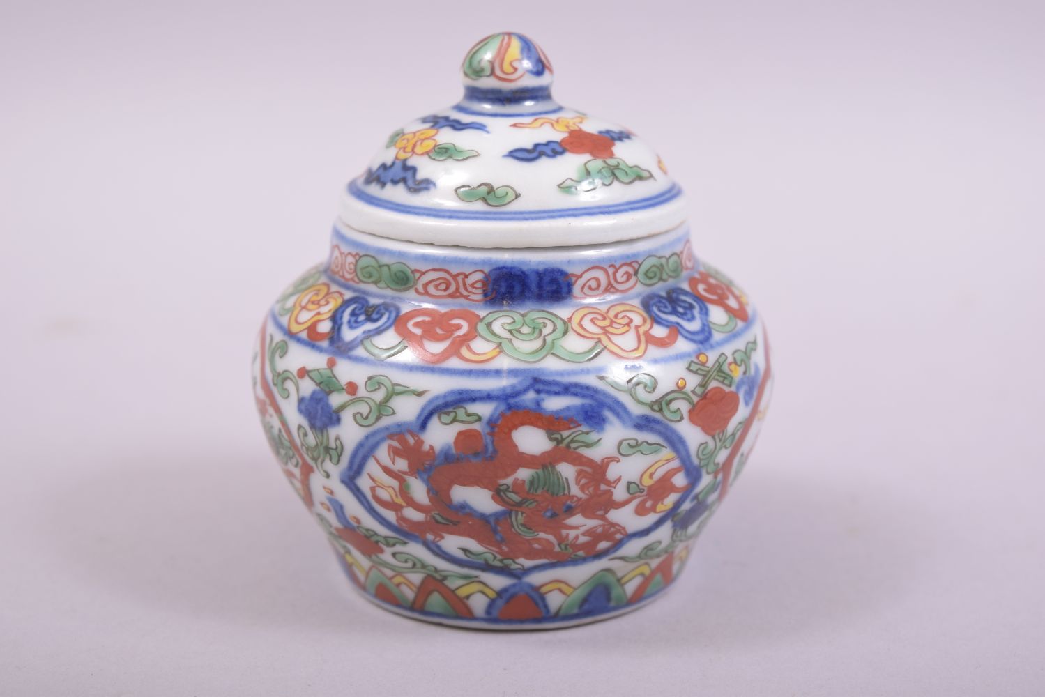 A SMALL CHINESE PORCELAIN DOUCAI POT AND COVER, decorated in the doucai palette with dragons, the - Image 2 of 9