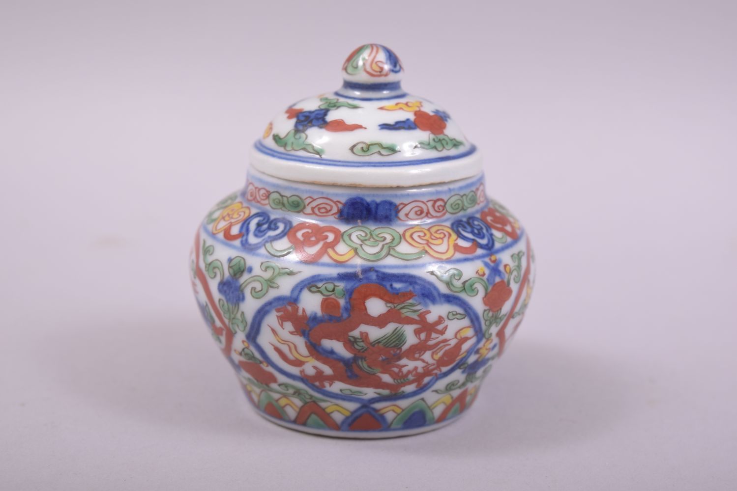A SMALL CHINESE PORCELAIN DOUCAI POT AND COVER, decorated in the doucai palette with dragons, the - Image 4 of 9