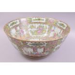 A LARGE CHINESE CANTON PORCELAIN PUNCH BOWL, painted with panels of figures, birds and native flora,