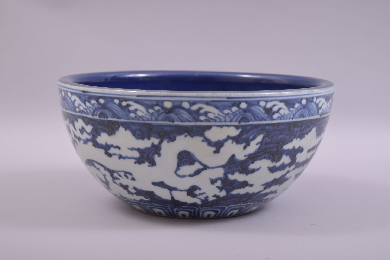 A LARGE CHINESE SACRIFICIAL BLUE GLAZE DRAGON BOWL, the exterior with white dragons and clouds - Image 3 of 7