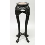 A CHINESE HARDWOOD AND MARBLE INSET CIRCULAR VASE STAND, with pierced and carved frieze and