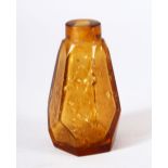 A CHINESE AMBER GLASS & GOLD FLAKE SNUFF BOTTLE, of tapering hexagonal form.