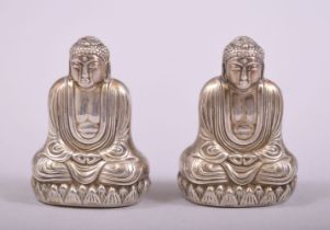 A SMALL PAIR OF SILVER BUDDHA SALT AND PEPPER VESSELS, each stamped 'sterling 950', each 4cm.