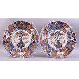 A GOOD LARGE PAIR OF JAPANESE CIRCULAR IMARI CHARGERS, each decorated to the centre with a prunus in