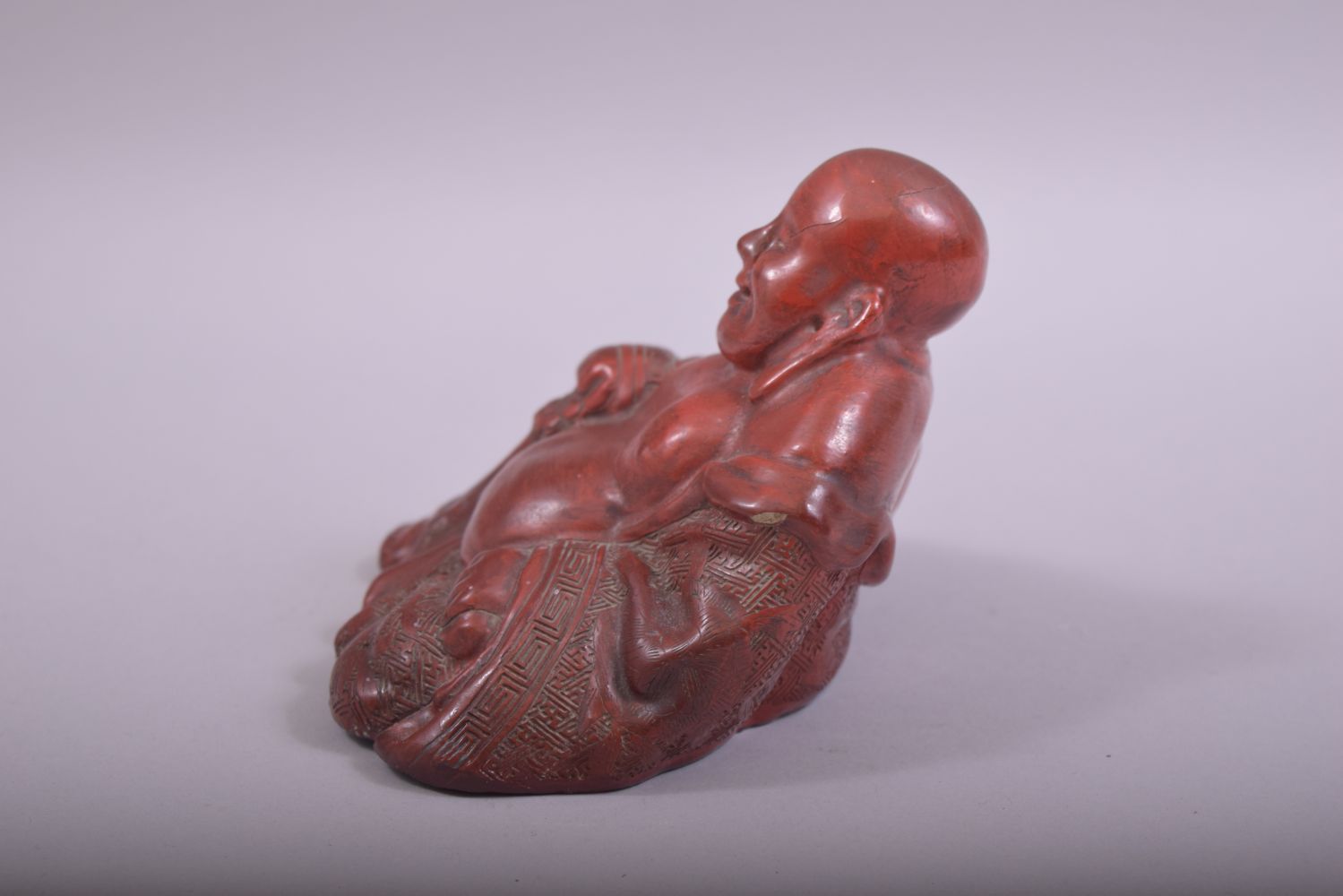 A CHINESE RED LACQUERED FIGURE OF BUDDHA, base 14.5cm wide. - Image 2 of 6