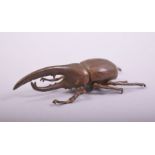 A JAPANESE BRONZE MODEL BEETLE, mark to underside, 7.5cm long.