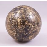 AN INDO-PERSIAN HEAVY BRASS CELESTIAL GLOBE, the spherical form with engraved markings, characters
