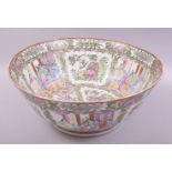 A LARGE CHINESE CANTON PORCELAIN PUNCH BOWL, painted with panels of figures, birds and native flora,