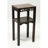 A CHINESE HARDWOOD RECTANGULAR TWO TIER URN STAND, with pierced and carved frieze, on square legs,