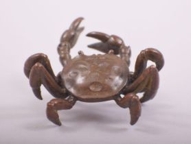 A SMALL JAPANESE BRONZE MODEL OF A CRAB, stamped underside, 6cm wide.