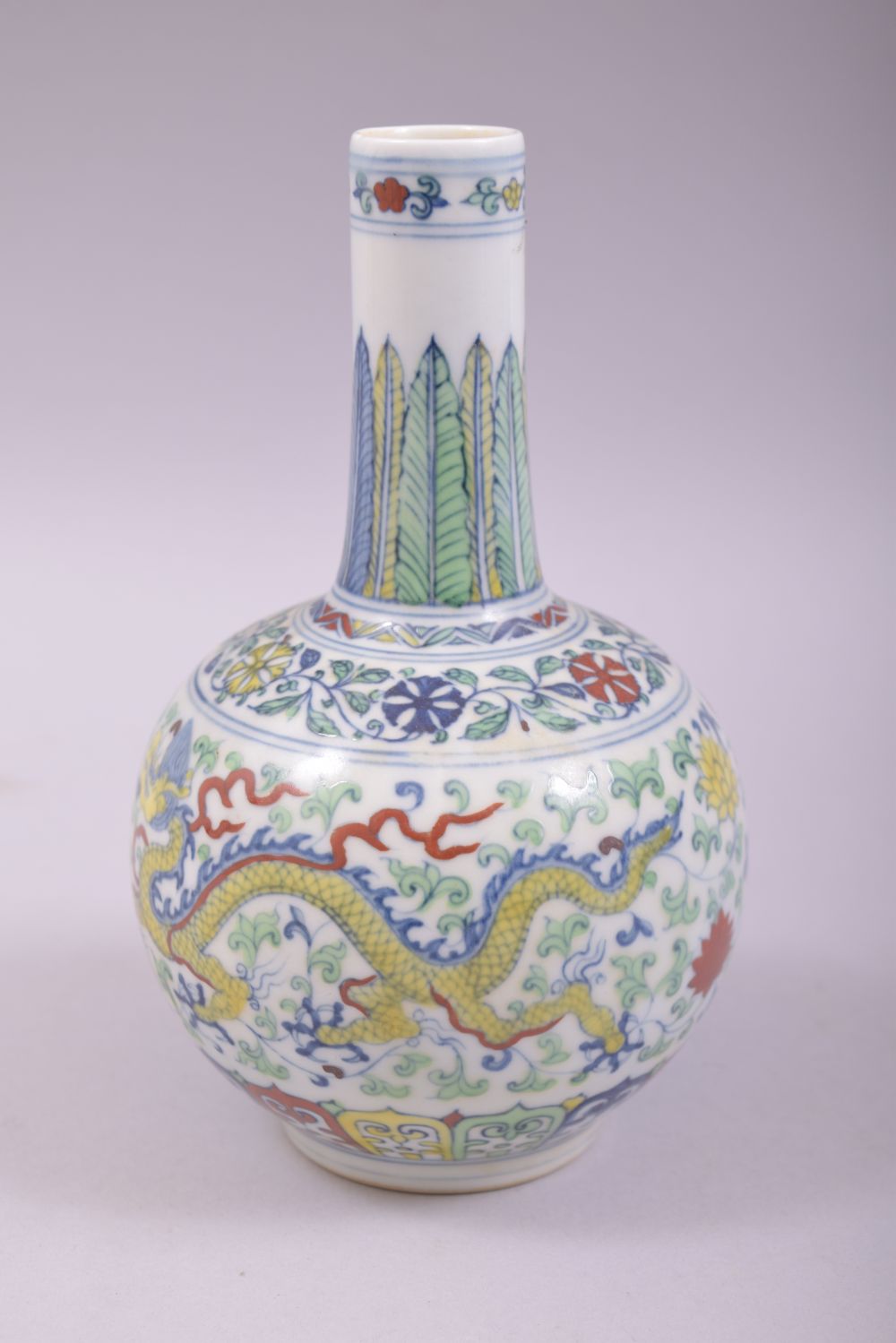 A SMALL CHINESE DOUCAI PORCELAIN BOTTLE VASE, painted in the doucai palette with a dragon and - Image 2 of 7