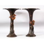 A PAIR OF JAPANESE BRONZE FLUTED VASES, with naturalistically applied metalwork flowers, 37cm high.
