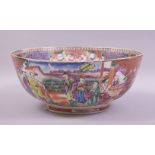 A LARGE CHINESE MANDARIN FAMILLE ROSE AND IRON RED PORCELAIN BOWL, painted with panels of figures in