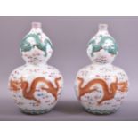 A GOOD PAIR OF CHINESE PORCELAIN GUORD SHAPE VASES, decorated with dragons and the flaming pearl