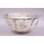 A LARGE PERSIAN TIMURID POTTERY BOWL, decorated with various stylised motifs, 22cm diameter.
