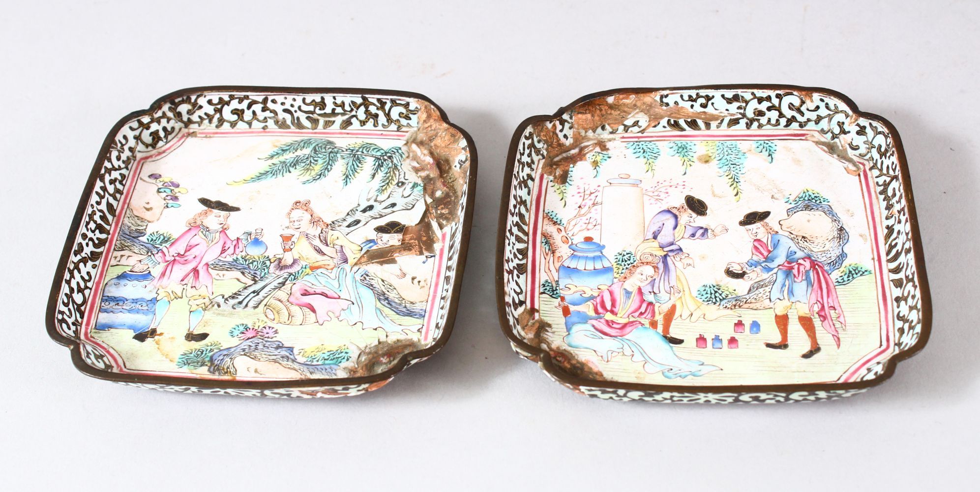 A PAIR OF CHINESE CANTON ENAMELLED DISHES, painted with European figures in outdoor settings, 10cm