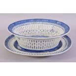 A CHINESE BLUE AND WHITE PIERCED PORCELAIN BASKET AND TRAY, the central interior painted with a