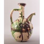 A 19TH CENTURY TURKISH CANAKKALE POTTERY EWER, 26.5cm high.