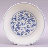 A GOOD CHINESE BLUE AND WHITE PORCELAIN DISH, the centre painted with bats and stylised clouds,