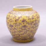 A CHINESE MING STYLE YELLOW GROUND PORCELAIN VASE, decorated with vine and stylised flower heads,