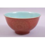 A CHINESE CORAL RED AND TURQUOISE GLAZED PORCELAIN BOWL, the exterior decorated in gilt with