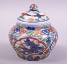 A SMALL CHINESE PORCELAIN DOUCAI POT AND COVER, decorated in the doucai palette with dragons, the