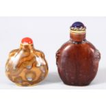 TWO CHINESE PORCELAIN SNUFF BOTTLES - one jun ware twin handle snuff bottle, the other of graduating