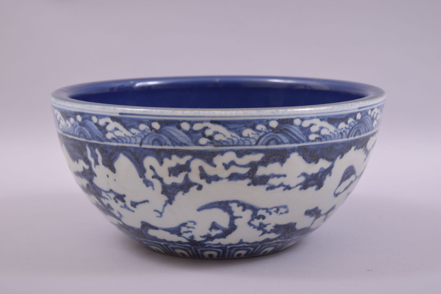 A LARGE CHINESE SACRIFICIAL BLUE GLAZE DRAGON BOWL, the exterior with white dragons and clouds - Image 2 of 7